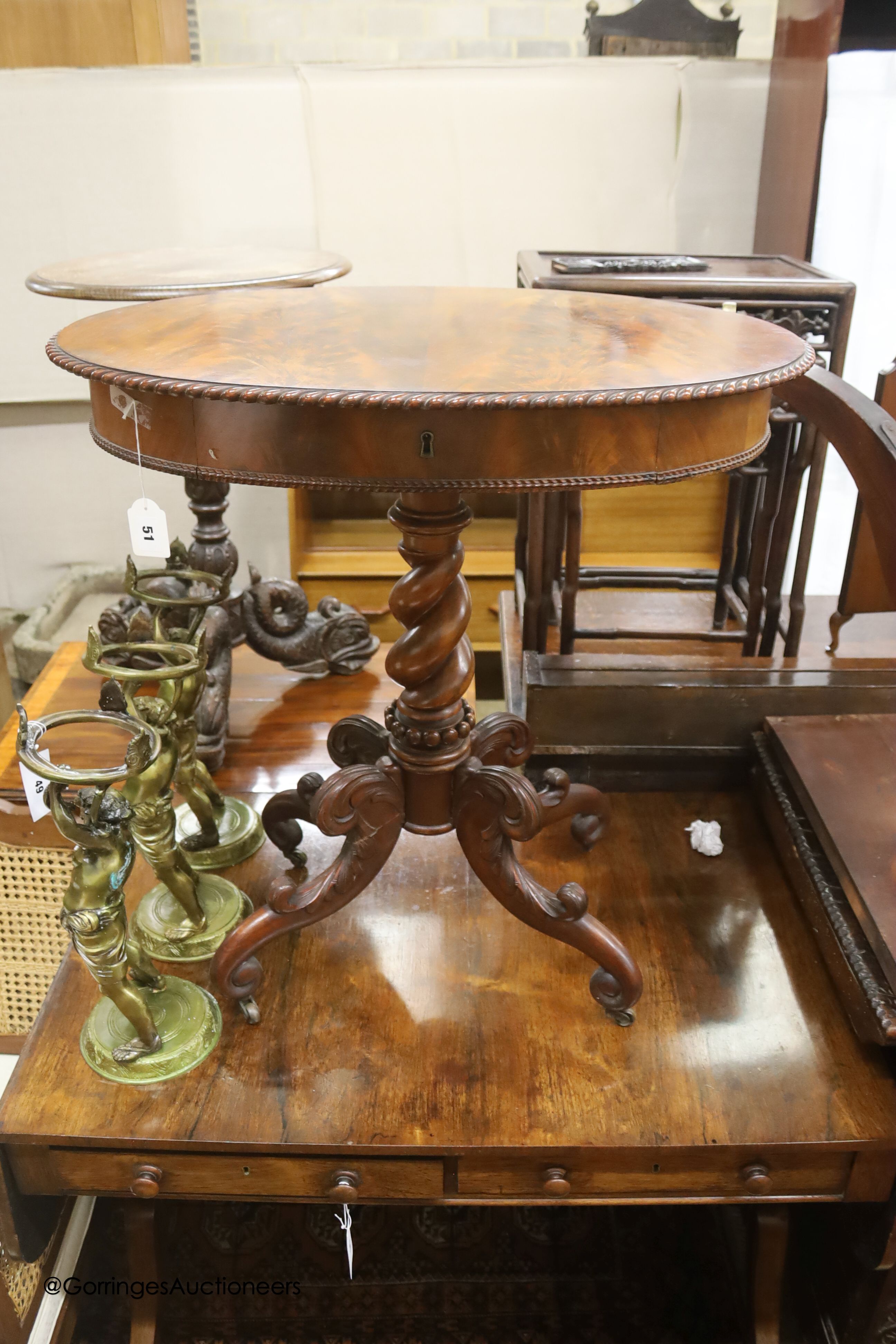 An oval French flamed mahogany occasional table, width 70cm, depth 52cm, height 74cm